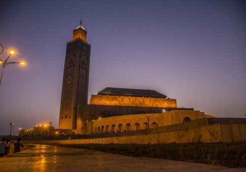 Sunset with the illuminated mosque in Hassan II Mosque of Casablanca. Morocco
